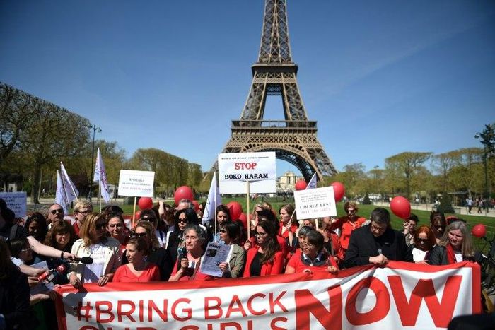 "Bring Back Our Girls" campaigners rally in front of the Eiffel Tower in Paris in April 2014 