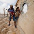 Libyan forces allied with the U.N.-backed government take cover during a battle with Islamic State fighters in Sirte, Libya, July 15, 2016. REUTERS/Goran Tomasevic/File Photo