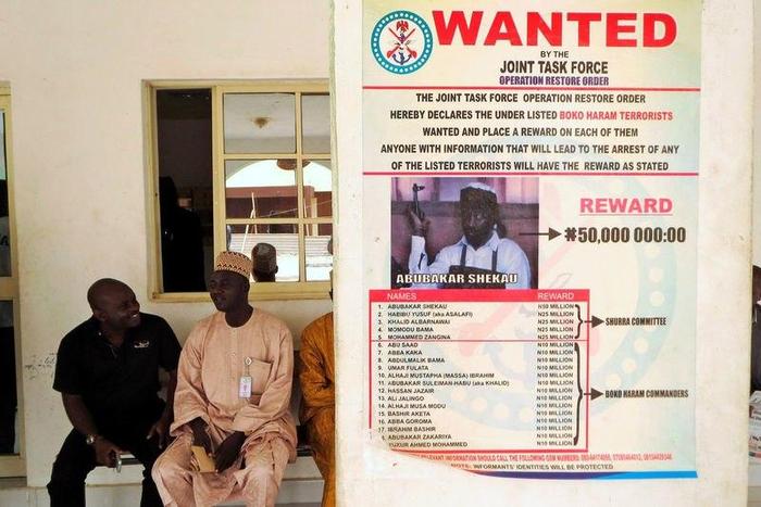 FILE PHOTO - A poster advertising for the search of Boko Haram leader Abubakar Shekau is pasted on a wall in Baga village on the outskirts of Maiduguri, in the north-eastern state of Borno, Nigeria May 13, 2013.