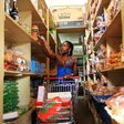 A woman shops at a grocery store in Hoima town, Uganda April 27, 2015.      Picture taken April 27, 2015 REUTERS/James Akena