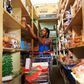 A woman shops at a grocery store in Hoima town, Uganda April 27, 2015.      Picture taken April 27, 2015 REUTERS/James Akena