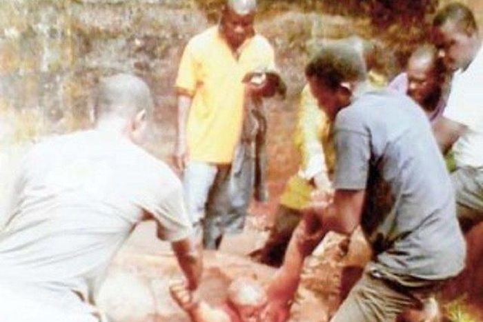 The deceased being brought out the well