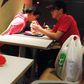 Picture of waiter feeding burger to disabled customer goes viral