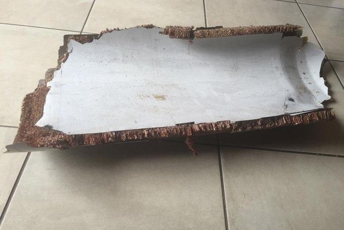 A piece of debris found by a South African family off the Mozambique coast in December 2015, which authorities will examine to see if it is from missing Malaysia Airlines flight MH370, is pictured in this handout photo released to Reuters March 11, 201...