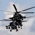 Russian Mi-28Ns from the Berkuty (Golden Eagles) helicopter display team fly in formation during the Aviadarts military aviation competition at the Dubrovichi range near Ryazan, Russia, August 2, 2015. REUTERS/Maxim Shemetov