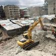 Rescue workers use a bulldozer as they continue to search for survivors in Huruma neighbourhood in the rubble of a six-storey building that collapsed in Nairobi, Kenya, May 5, 2016.     REUTERS/Thomas Mukoya