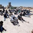 Migrants, who attempted to flee the Libyan coast to head for Europe, are seen after being detained at the coast guard center in the coastal city of Tripoli, Libya, May 16, 2016.