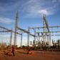 Security guards arrive with dogs for their shift at a power station in Gaborone, Botswana, November 23, 2015. REUTERS/Siphiwe Sibeko