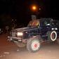 Malian police stand guard in an armored vehicle near the site of an attack on a hotel in Bamako that had been converted into the headquarters of a European Union military training operation, March 21, 2016. REUTERS/Adama Diarra
