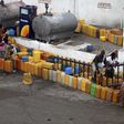 Plastic containers are arranged at a fuel station as people wait to buy kerosene in Nigeria's commercial capital Lagos, in this June 9, 2011 file photo. REUTERS/Akintunde Akinleye/Files