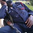 A tired Ghanaian police officer