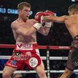 Amir Khan (maroon shorts) punches Canelo Alvarez (red shorts) during their middleweight boxing title fight at T-Mobile Arena.