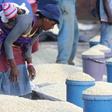A Zimbabwean woman sells maize in the capital Harare, March 3, 2- RTSAGJ3