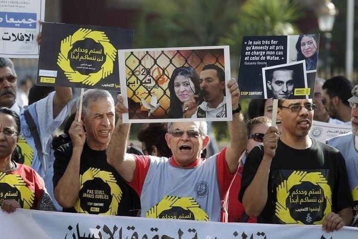Protesters take part in a demonstration called by Amnesty International on the International Day in Support of Victims of Torture, in Rabat, Morocco June 26, 2015.