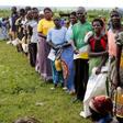 Malawians queue for food aid distributed by the United Nations World Food Progamme (WFP) in Mzumazi village near the capital Lilongwe, February 3, 2016.