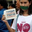 Thai police charge two eight-year-old girls who tore down pink lists