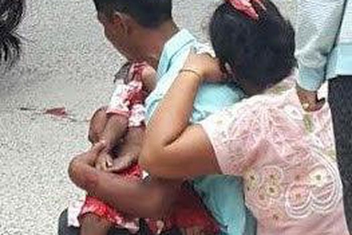 Mr and Mrs Myanmar weeping over their son