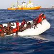 Migrants sit in a rubber dinghy during a rescue operation by SOS Mediterranee ship Aquarius off the coast of the Italian island of Lampedusa in this handout received April 18, 2016.
