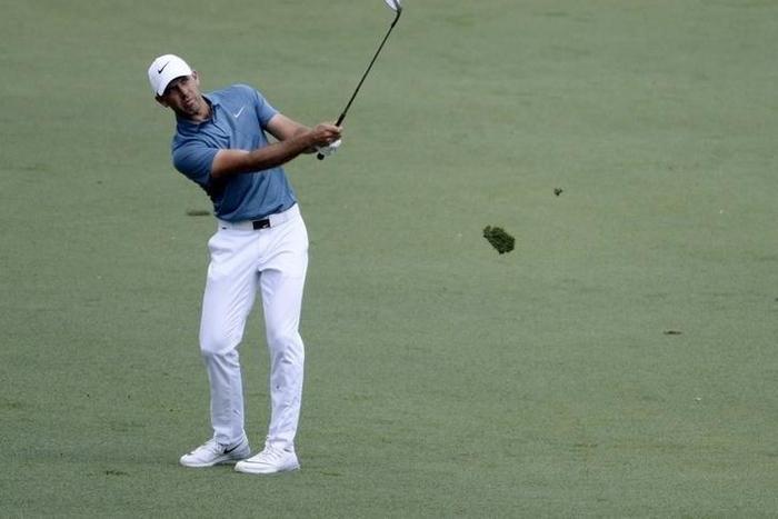Charl Schwartzel plays a shot on the 15th hole during the first round of the 2016 The Masters golf tournament at Augusta National Golf Club.
