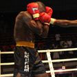 Abolaji "Afonja Warrior" Rasheed hits an opponent hard
