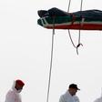 A dead body is disembarked from the Italian Navy vessel Vega at the Reggio Calabria harbour, southern Italy, May 29, 2016.