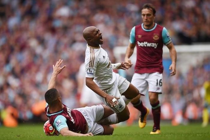 West Ham United v Swansea City - Barclays Premier League - Upton Park - 7/5/16 West Ham's Winston Reid in action with Swansea City's Andre Ayew
