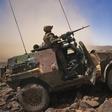 A French soldier stands guard in an armoured vehicle , about 60 km (37 miles) south of the town of Tessalit in northern Mali March 21, 2013.