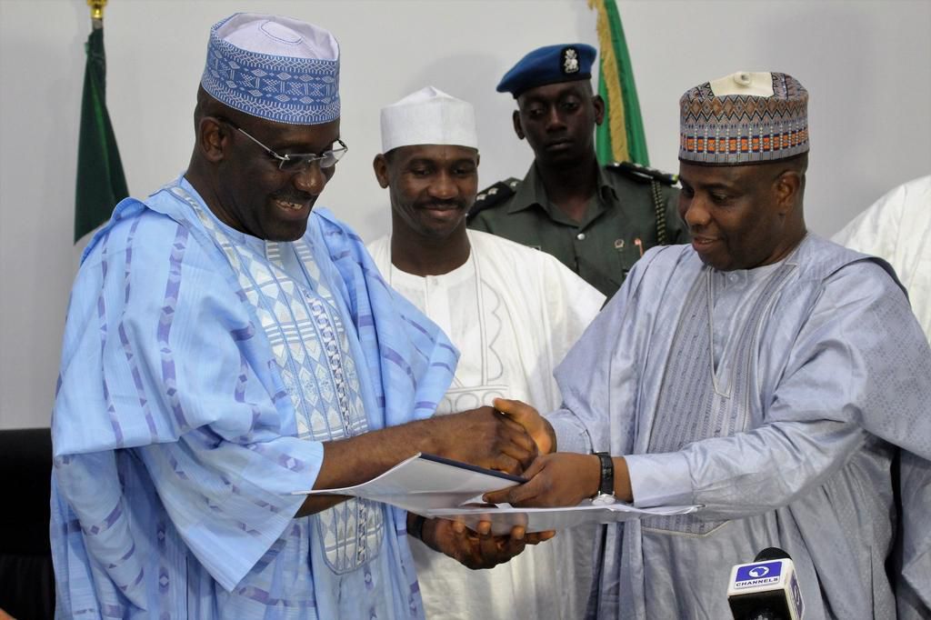 L-R: Ag Managing Director of Bank of Industry, Mr. Wahid Olagunju with Sokoto State Governor, Aminu Waziri Tambuwal, after the signing of agreement to provide N2billion to SMEs in Sokoto. Middle of Deputy Governor Ahmed Aliyu....Thursday 05/05/2016