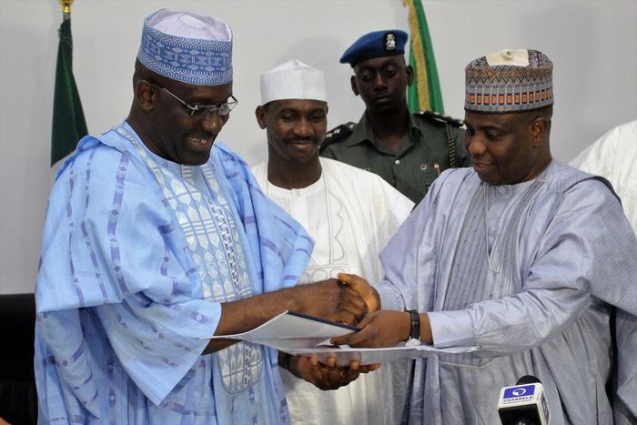 L-R: Ag Managing Director of Bank of Industry, Mr. Wahid Olagunju with Sokoto State Governor, Aminu Waziri Tambuwal, after the signing of agreement to provide N2billion to SMEs in Sokoto. Middle of Deputy Governor Ahmed Aliyu....Thursday 05/05/2016