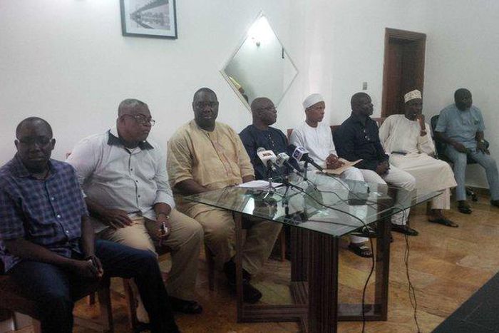 Chris Giwa flanked by members of his board