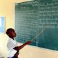 A pupil reading from the chalkboard
