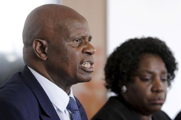 Zimbabwe's Finance Minister Patrick Chinamasa (L) addresses a media conference after meeting International Monetary Fund (IMF) Executive Director for Africa Chileshe Kapwepwe (R) in Harare, September 7, 2015. REUTERS/Philimon Bulawayo