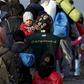 Migrants wait to enter a transit camp after entering the country by crossing the border with Greece in Gevgelija, Macedonia, November 10, 2015.