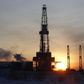 A general view shows an drilling rig at the Lukoil company owned Imilorskoye oil field, as the sun rises, outside the West Siberian city of Kogalym, Russia, January 25, 2016. Picture taken January 25, 2016.