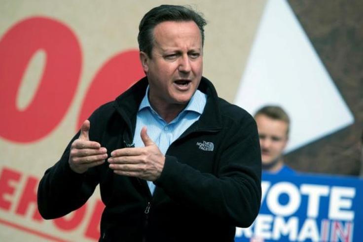British PM Cameron stands by "divisive, stupid and wrong" comment on Trump