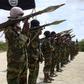 Al Shabaab militants parade new recruits after arriving in Mogadishufrom their training camp south of the capital in this October 21, 2010 file photo. REUTERS/Feisal Omar/Files