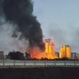 A fire next to the Libyan cement factory is seen during clashes between military forces loyal to Libya's eastern government, who are backed by the locals, and the Shura Council of Libyan Revolutionaries, an alliance of former anti-Gaddafi rebels, who h...