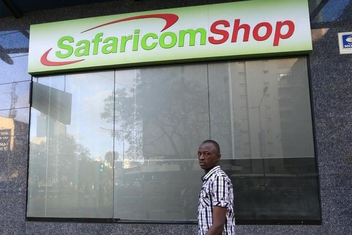 A man walks past a Safaricom shop, a mobile telecommunication provider in Kenya's capital Nairobi November 15, 2015.