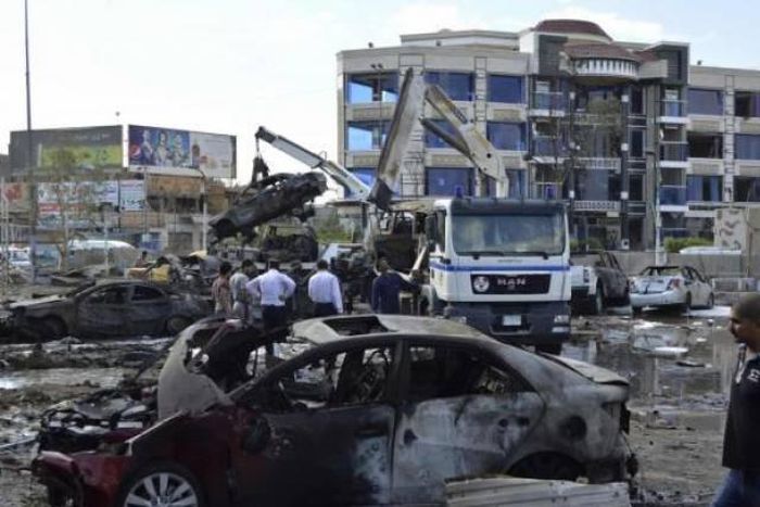 Suicide car bomber kills at least 14 north of Baghdad - police