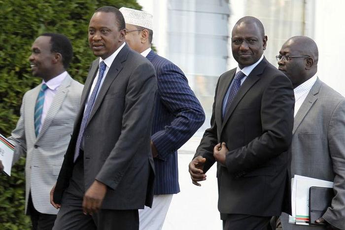 Kenya's President Uhuru Kenyatta (front L) and his Deputy William Ruto (front R) leave the State House after Kenyatta's case at the International Criminal Court (ICC) was dropped, in the capital Nairobi in this December 5, 2014.