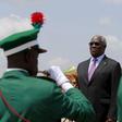 Sao Tome and Principe's President Manuel Pinto da Costa stands on the podium inspecting the honour guards at the airport in Abuja, Nigeria May 28, 2015.