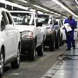 A worker inspects cars at Nissan's manufacturing plant in Rosslyn, outside Pretoria, in a file photo.