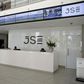 People walk near the reception at the Johannesburg Stock Exchange (JSE) in Sandton, Johannesburg, South Africa December 10, 2015.