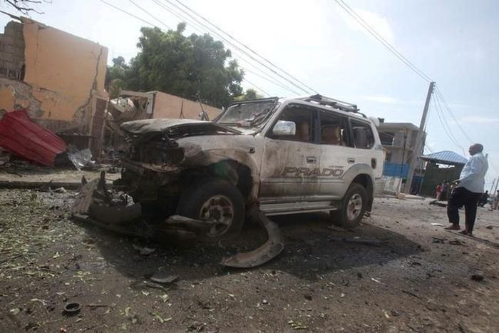The wreckage of a car destroyed during a suicide bombing is seen near the African Union's main peacekeeping base in Mogadishu, Somalia, July 26, 2016. REUTERS/Ismail Taxta