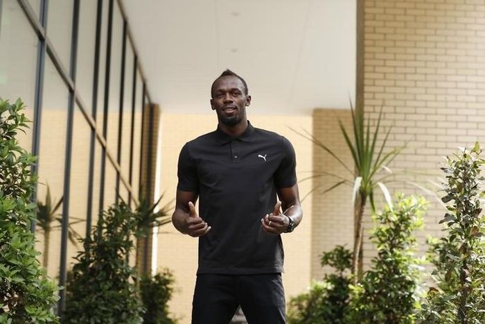 Jamaica's Usain Bolt poses before the press conference