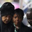 Former South African President Nelson Mandela's ex-wife Winnie Mandela (L) arrives at the First National Bank (FNB) Stadium, also known as Soccer City, ahead of the national memorial service for Nelson Mandela in Johannesburg December 10, 2013.