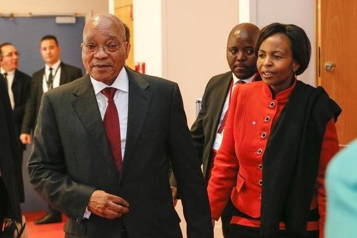 South Africa's President Jacob Zuma (L) leaves after a summit on health and sanitary security in Lyon, France, March 23, 2016.