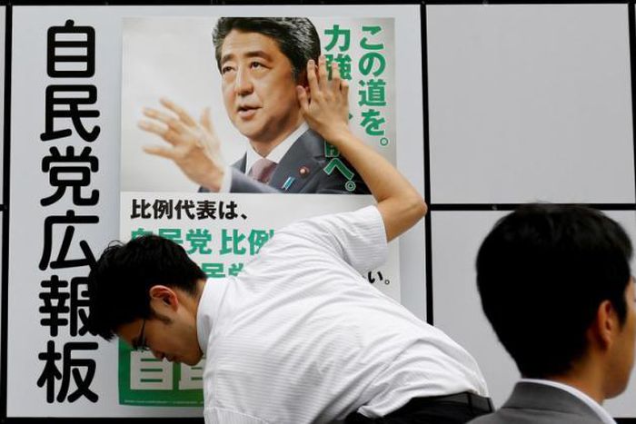 Japan PM campaigns on "stability" ticket as Brexit rocks markets