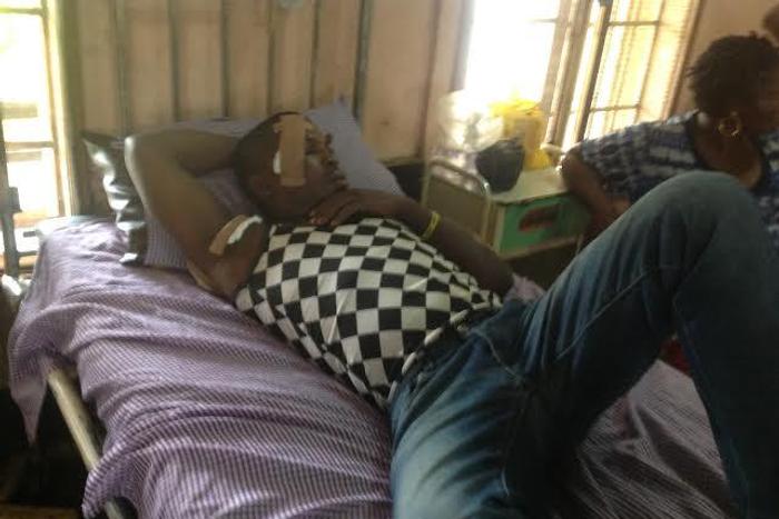 Emmanuel Francis lying on his hospital bed