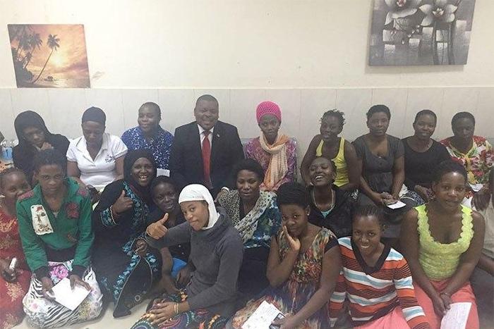 Some of the Ugandans recently facilitated to return home with Uganda's ambassador to Saudi Arabia Sheikh Rashid Yahya Ssemuddu